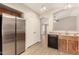 A kitchen featuring stainless steel appliances, light brown cabinets, and light wood floors at 10317 E Kiva Cir, Mesa, AZ 85209