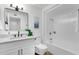 Bathroom featuring a shower-tub combo, modern fixtures, and white vanity with a large mirror at 10502 W Hutton Dr, Sun City, AZ 85351