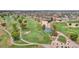 Aerial view of a golf course with lush green fairways, mature trees, and well-maintained landscaping in a residential neighborhood at 10502 W Hutton Dr, Sun City, AZ 85351
