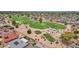 Aerial view of golf course with lush green fairways, mature trees, and well-maintained landscaping in a residential neighborhood at 10502 W Hutton Dr, Sun City, AZ 85351