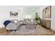 Cozy living room with stylish decor, a large mirror and comfortable seating at 10502 W Hutton Dr, Sun City, AZ 85351