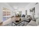 Open-concept living area with bright, airy design and seamless transition to the dining area at 10502 W Hutton Dr, Sun City, AZ 85351