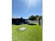 This backyard offers artificial turf, a covered patio with a pool, ideal for entertaining and relaxation at 10852 N 39Th Ave, Phoenix, AZ 85029