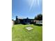 Lush backyard offers an appealing mix of artificial turf, mature trees, a covered patio, and swimming pool at 10852 N 39Th Ave, Phoenix, AZ 85029