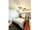 Cozy bedroom with ceiling fan, wood floors, and built-in shelving, offering ample storage space at 10852 N 39Th Ave, Phoenix, AZ 85029