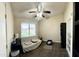 Bonus room features tiled floors, a ceiling fan and a window for plenty of natural light at 10852 N 39Th Ave, Phoenix, AZ 85029