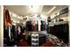 Spacious walk-in closet with circular racks, shelving, and organizers for optimal storage at 10852 N 39Th Ave, Phoenix, AZ 85029