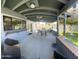 Enjoy this covered patio with a bar, dining area and view of the pool and manicured backyard at 10852 N 39Th Ave, Phoenix, AZ 85029