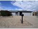 Well-maintained single-story home with tidy landscaping, a two-car garage, and wide driveway at 10852 N 39Th Ave, Phoenix, AZ 85029