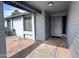 Covered front porch entry with decorative security door and painted brick detail at 10852 N 39Th Ave, Phoenix, AZ 85029