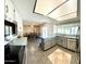 Well-lit kitchen featuring lots of counter space, nice appliances, and an adjacent dining area at 10852 N 39Th Ave, Phoenix, AZ 85029