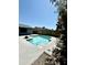 Backyard pool with pristine blue water. The deck is accented with a small rock area, providing a calming oasis at 10852 N 39Th Ave, Phoenix, AZ 85029