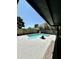 Backyard pool offering a refreshing escape, complemented by landscaping. A shady overhang is perfect for hot summer days at 10852 N 39Th Ave, Phoenix, AZ 85029