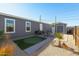 The backyard features a patio, artificial grass, a dining set, desert landscaping, and a shed at 10951 N 91St Ave # 6, Peoria, AZ 85345