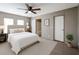 Cozy bedroom features a comfortable bed, soft carpet, and an ensuite bathroom for added convenience at 10951 N 91St Ave # 6, Peoria, AZ 85345