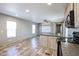 Open kitchen and living room area with wood cabinets and lots of natural light at 10951 N 91St Ave # 6, Peoria, AZ 85345