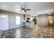 Open kitchen and living room area with wood cabinets and lots of natural light at 10951 N 91St Ave # 6, Peoria, AZ 85345