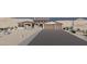 This beautiful home features a stone facade, large windows, and a spacious three-car garage at 11648 S Airport Rd, Buckeye, AZ 85326