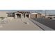 This beautiful home features a stone facade, large windows, and a spacious three-car garage at 11648 S Airport Rd, Buckeye, AZ 85326