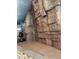 Indoor climbing wall area featuring textured rock surfaces and safety matting at 12512 N 85Th Ave, Peoria, AZ 85381
