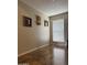 Bright room with wood floors, a large window, and neutral wall paint, ready for personalization at 12512 N 85Th Ave, Peoria, AZ 85381