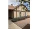 Side view of a single-Gathering home with desert landscaping and a manicured garden at 12512 N 85Th Ave, Peoria, AZ 85381