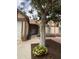 Cozy home exterior with beautiful landscaping, flowers, and a well-maintained walkway at 12512 N 85Th Ave, Peoria, AZ 85381