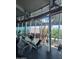 Brightly lit fitness center with weightlifting equipment and scenic outdoor views at 12512 N 85Th Ave, Peoria, AZ 85381