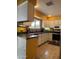 Efficient kitchen with stainless steel appliances, white cabinets, and a mosaic backsplash for a modern touch at 12512 N 85Th Ave, Peoria, AZ 85381