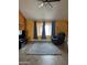 Spacious living room with a large area rug, comfortable seating, and plenty of natural light at 12512 N 85Th Ave, Peoria, AZ 85381