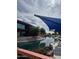 Picturesque community pond area with shade sails and waterfront walkway seating at 12512 N 85Th Ave, Peoria, AZ 85381