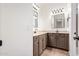 Bathroom featuring dual sinks, stylish fixtures and tile flooring at 14188 W Hope Dr, Surprise, AZ 85379