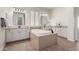 Luxurious bathroom with a large soaking tub, double sinks, and ample cabinet space at 14188 W Hope Dr, Surprise, AZ 85379