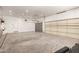 Spacious garage with two garage doors and plenty of room for parking and storage at 14188 W Hope Dr, Surprise, AZ 85379