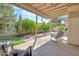 Charming backyard patio area with stone pavers, landscaping, and comfortable seating at 155 W Knox Rd, Tempe, AZ 85284