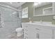 Modern bathroom featuring tiled shower, updated vanity, and contemporary fixtures at 155 W Knox Rd, Tempe, AZ 85284