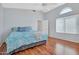 Comfortable bedroom featuring a ceiling fan, vaulted ceiling and wooden floor at 155 W Knox Rd, Tempe, AZ 85284