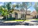 Charming two-story home with tile roof, well-manicured lawn, and mature shade trees at 155 W Knox Rd, Tempe, AZ 85284