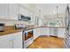 Well-lit kitchen with stainless steel appliances, granite countertops, and plenty of cabinet space at 155 W Knox Rd, Tempe, AZ 85284