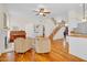 Spacious living area with hardwood floors, fireplace, and staircase to the upper level at 155 W Knox Rd, Tempe, AZ 85284