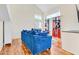 Bright living room featuring plush blue velvet sofa and high ceilings and view of windows at 155 W Knox Rd, Tempe, AZ 85284