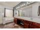 Large bathroom with a soaking tub, shower, and vanity with double sinks at 16022 W Desert Mirage Dr, Surprise, AZ 85379
