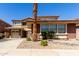 Two-story home featuring a 2-car garage, brick accents, and a well-maintained front yard with desert landscaping at 16022 W Desert Mirage Dr, Surprise, AZ 85379