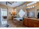 This spacious bathroom features a large tub, double vanity sinks, and ample natural light at 16441 S Mountain Stone Trl, Phoenix, AZ 85048