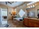 Primary bathroom with double vanities, a soaking tub, and an entrance to the bedroom at 16441 S Mountain Stone Trl, Phoenix, AZ 85048