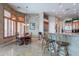 Charming breakfast nook with shuttered windows adjoining the kitchen, perfect for casual dining at 16441 S Mountain Stone Trl, Phoenix, AZ 85048