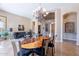 Open dining area with view to the front door, and open-concept floor plan at 16441 S Mountain Stone Trl, Phoenix, AZ 85048