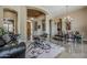 Elegant foyer featuring a grand entryway, arched doorways, and travertine flooring throughout at 16441 S Mountain Stone Trl, Phoenix, AZ 85048