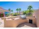 Outdoor grill station with built-in barbecue, perfect for cooking and dining outdoors at 16441 S Mountain Stone Trl, Phoenix, AZ 85048