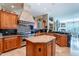 Gourmet kitchen featuring custom cabinets, granite countertops, and professional-grade Viking appliances at 16441 S Mountain Stone Trl, Phoenix, AZ 85048